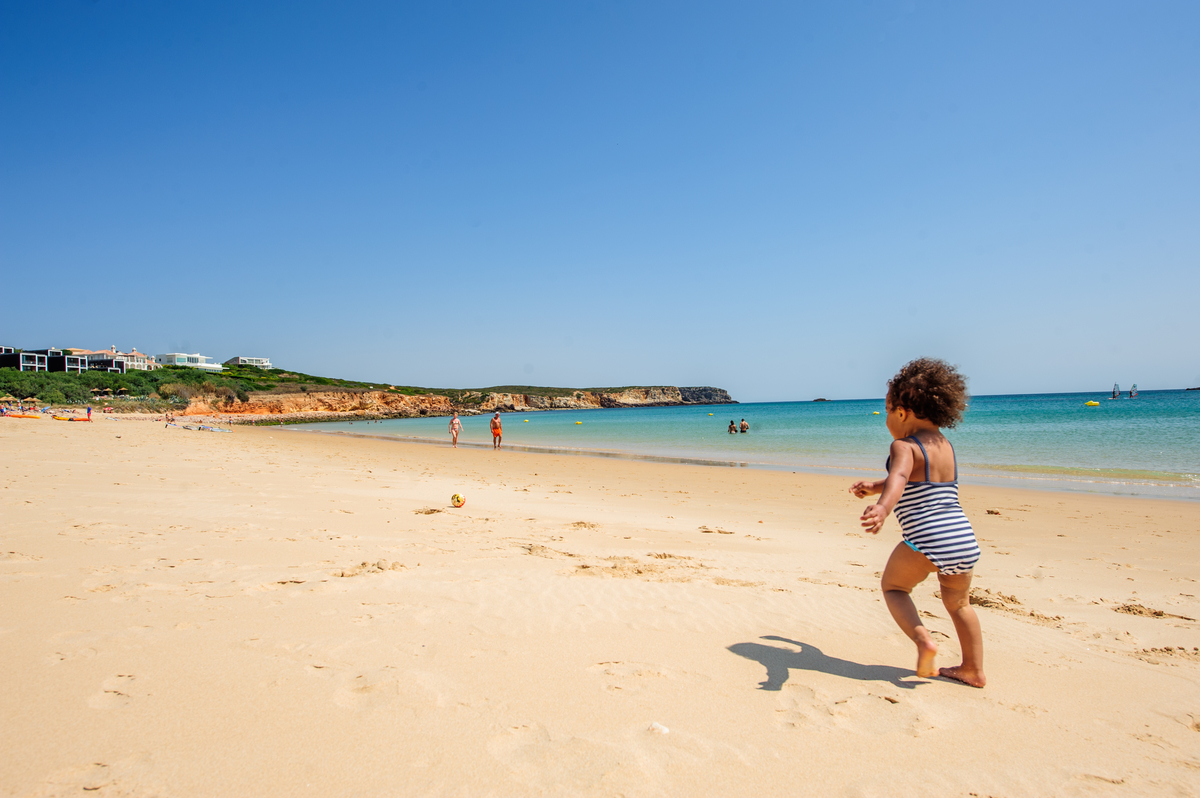 Praia do Martinhal beach. Image by Lola Akinmade Åkerström / Lonely Planet