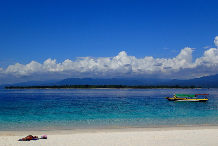 Sunbathing, Gili Meno. Image by Sarahtz CC BY 2.0