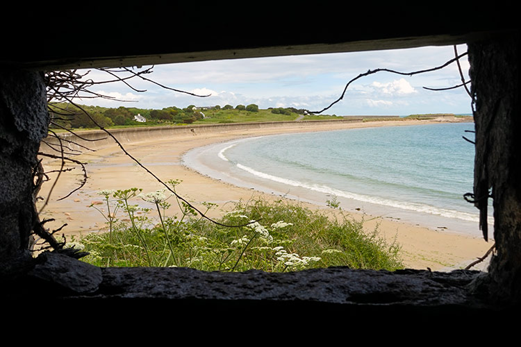 Alderney's Victorian forts and German bunkers - like this one looking out on Longis Bay - frame its natural environment in unexpected ways. Image by James Kay / Lonely Planet.