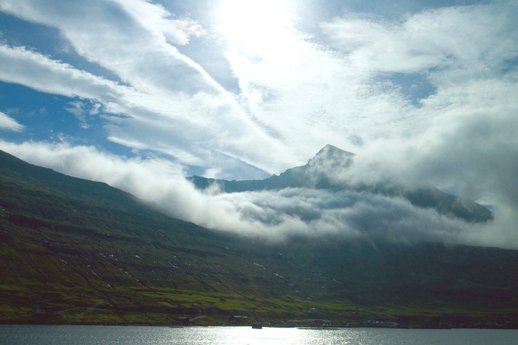 Dazzling morning light on Eysturoy. Image by Kerry Christiani / Lonely Planet