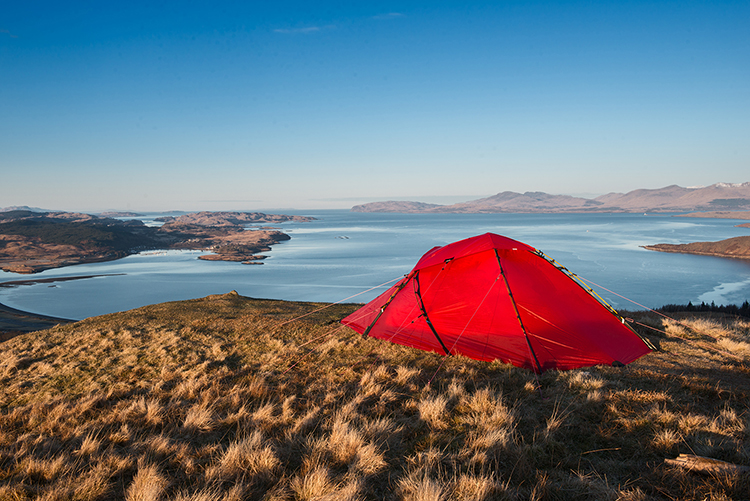 Wild camping on the summit of Ben Lora with a view of the Isle of Mull, Scotland. Image Paul McGee / Moment / Getty Images