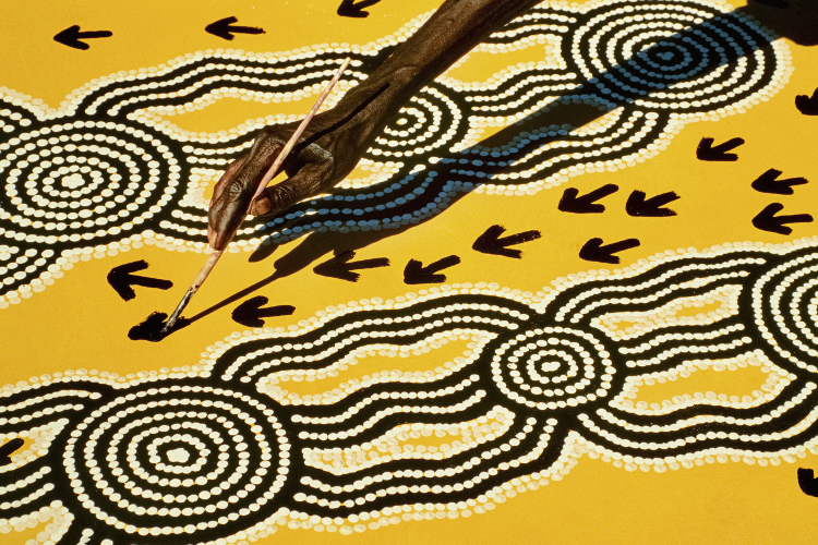 Aboriginal artist at work, Central Desert Australia. Image by Frans Lanting / Mint Images / Getty 