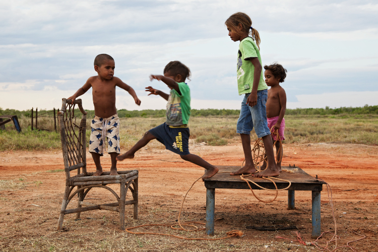 Children playing in the desert. Image by Ingetje Tadros / The Image Bank / Getty Images