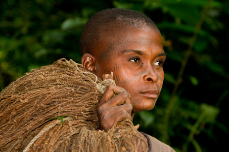 Portrait of a BaAka woman with facial tattoos after a net hunt. Image by Stuart Butler / Lonely Planet.