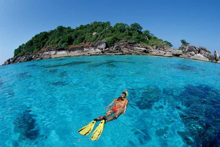 Woman snorkels in the Similan Islands, Thailand