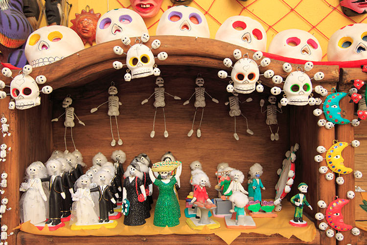 Folk art features heavily in Mexico's colourful Day of the Dead celebrations. Image by Wendy Connett / Robert Harding World Imagery / Getty Images