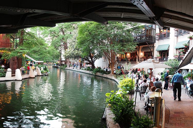 San Antonio’s Riverwalk is lined with shops and restaurants. Image by Pat David / CC BY-SA 2.0