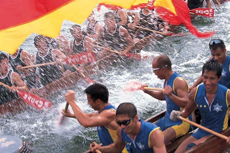 Teams taking part in a dragon boat race, Macau. Image courtesy of the Macau Government Tourism Board.