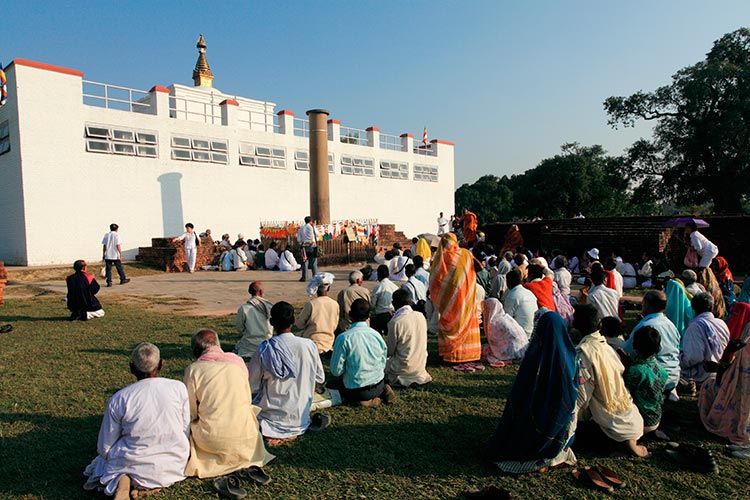 Buddhist pilgrims outside Lumbini's Maya Devi Temple. Image by Jenny Jones / Lonely Planet Images / Getty Images.