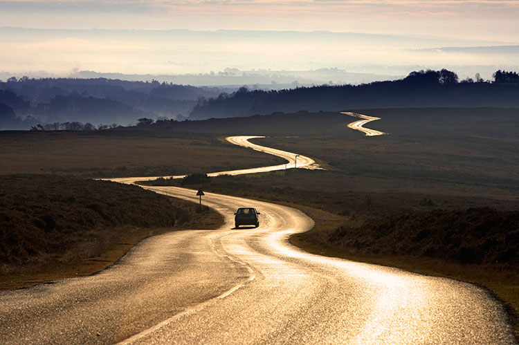 A road snaking across the lonesome yet lovely North York Moors. Image by LatitudeStock TTL / Gallo Images / Getty Images.