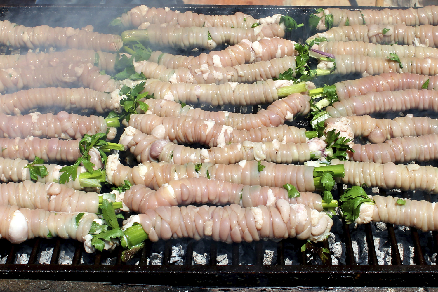 Stigghiola cooking on the grill