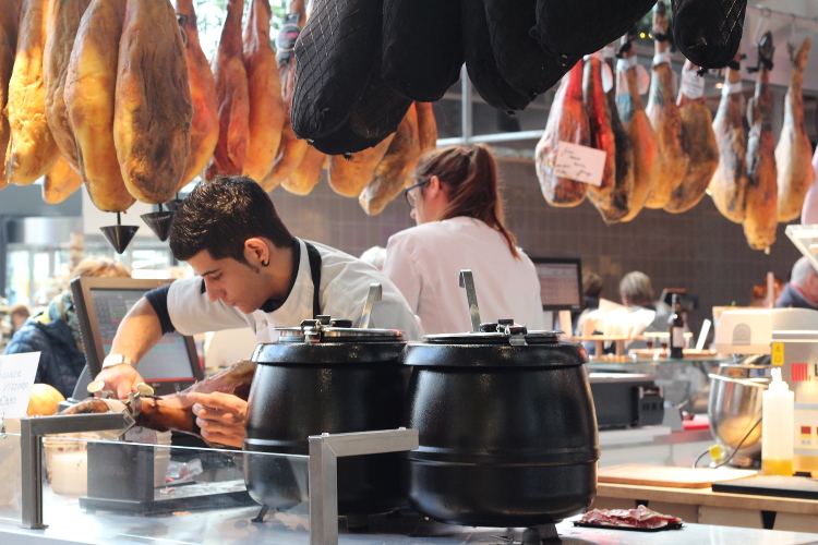 Hams hanging at Markthal food market, Rotterdam