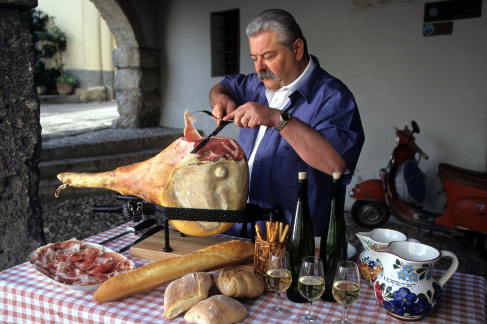 Slicing San Daniele prosciutto.