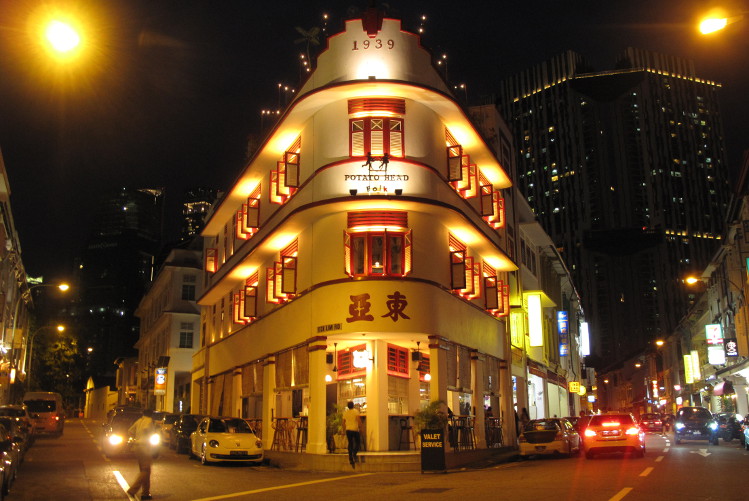 Brightly lit red-and-white Potato Head Folk bar in Singapore