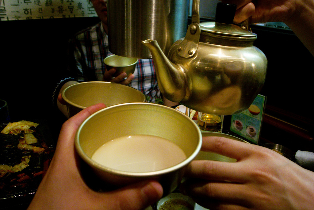 Makgeolli is often served from a brass teapot. Image by Jon Åslund / CC BY 2.0