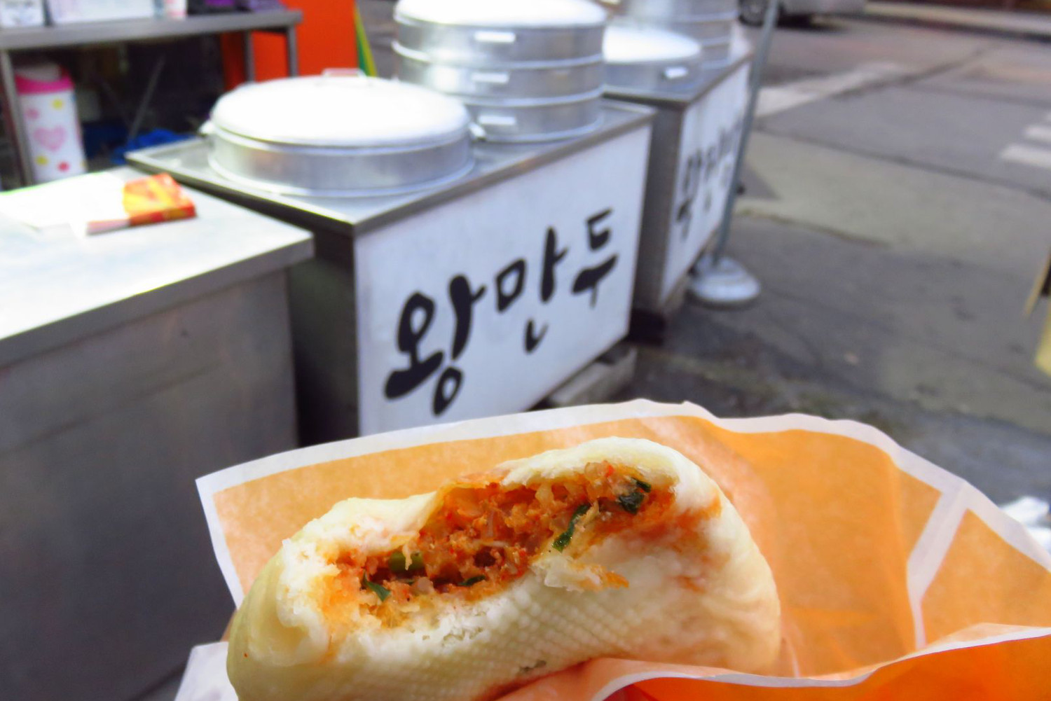 Spicy kimchi dumplings, a street food treat. Image by Phillip Tang / Lonely Planet