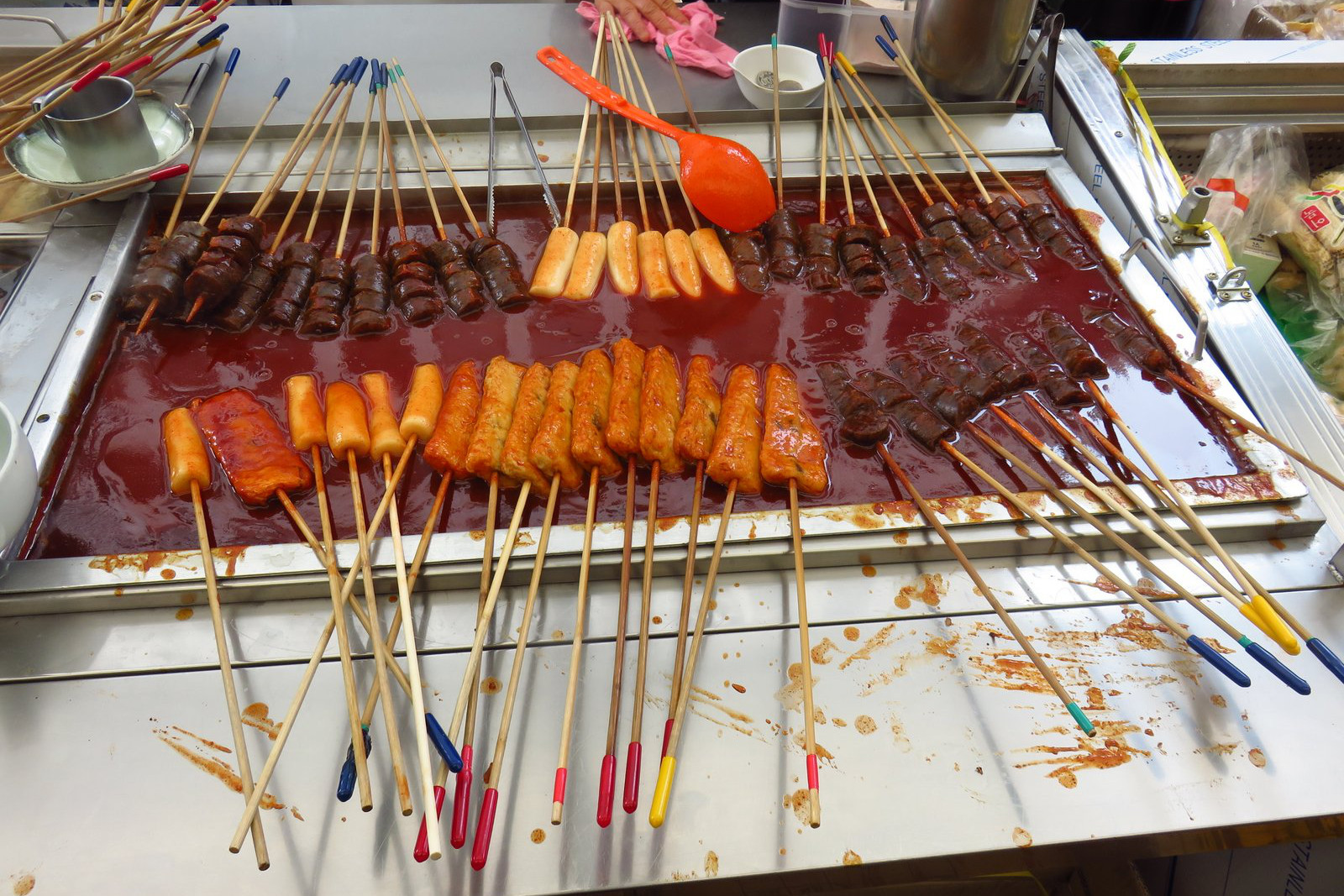 Odeng: fish cake skewers cooked in thick broth. Image by Phillip Tang / Lonely Planet