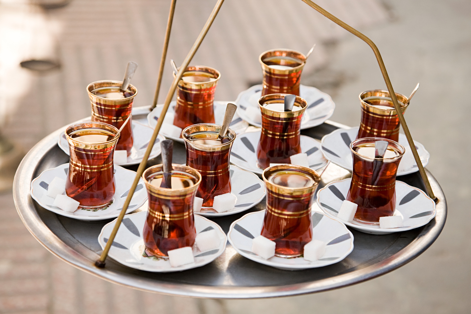 Wash down the Bazaar District's traditional dishes with a shot of apple tea. Image by Image Source / Getty