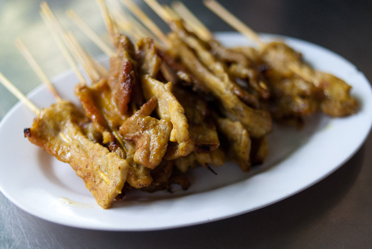 A dish of sate gai, chicken satay, Bangkok. Image by Austin Bush
