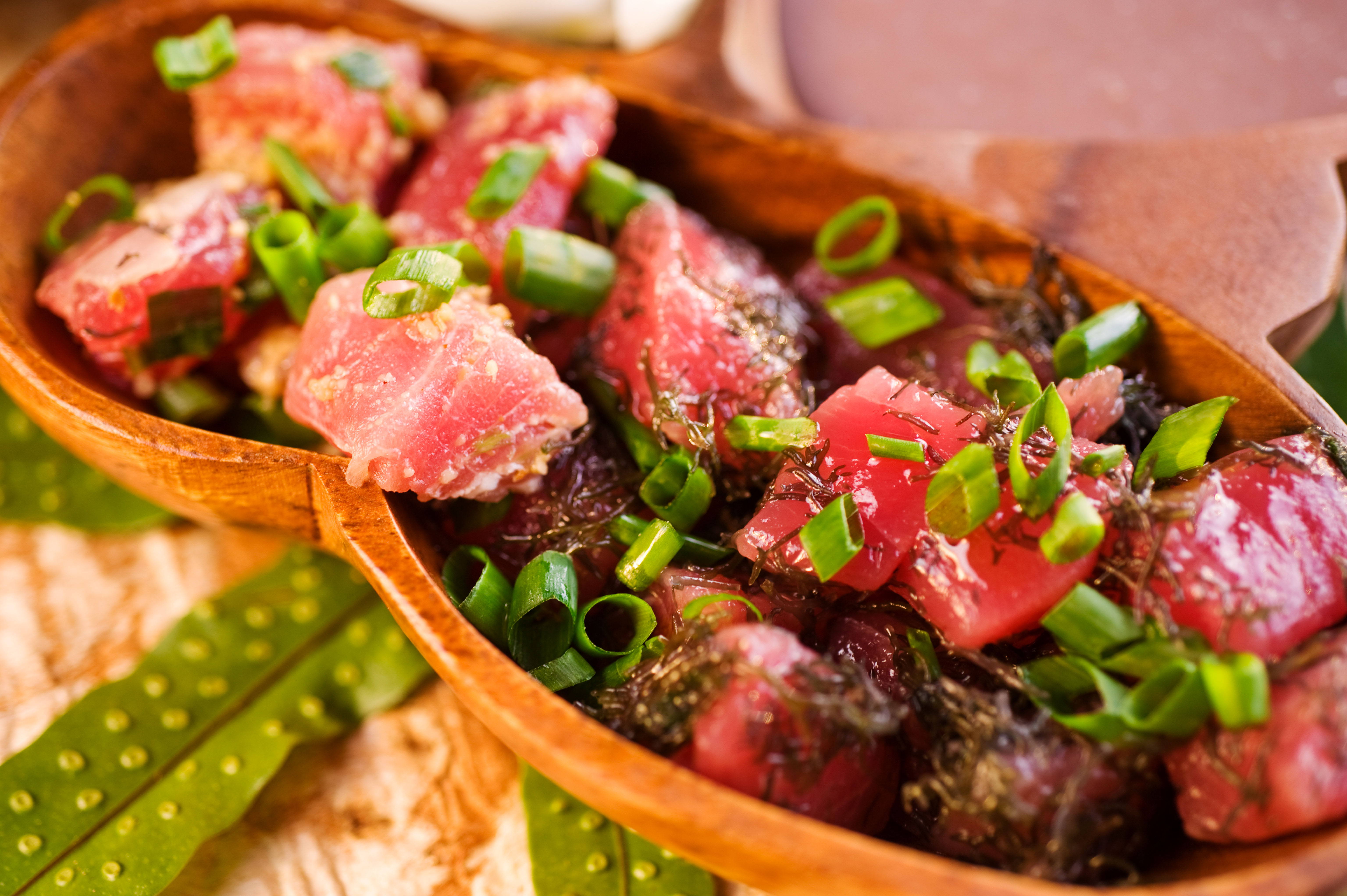 Plate of poke with macadamia nuts and seaweed. Image by Ann Cecil / Getty