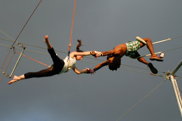 Learning the trapeze is sure to test the limits of your love. Image by Laura Bittner / CC BY 2.0.