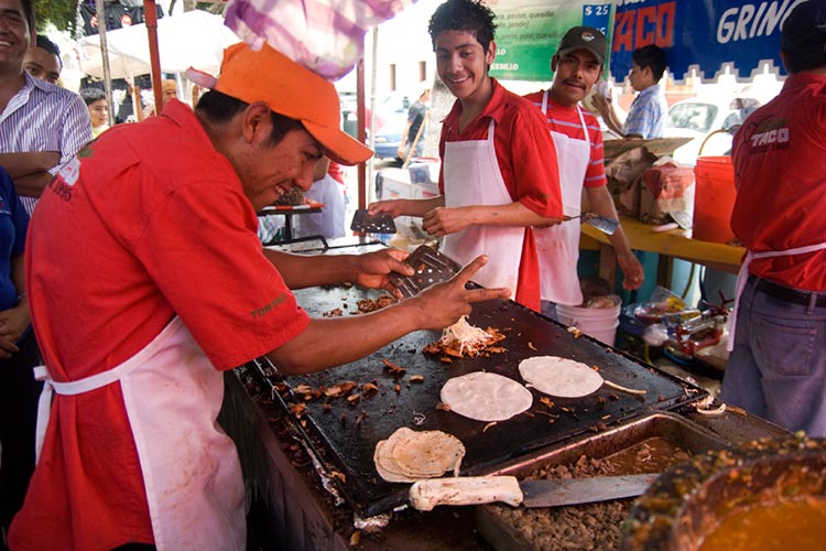 Nothing brings people together quite like making a banana leaf-wrapped tamale. Image by buzzthrill / CC BY 2.0.