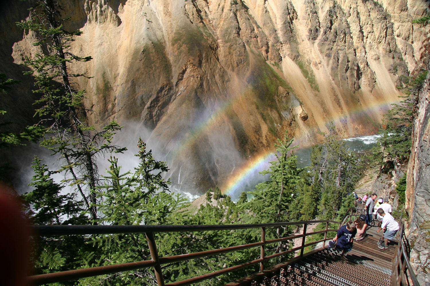 Rainbows bouncing off the spray at Yellowstone National Park's Grand Canyon. Image courtesy of Wyoming Office of Tourism