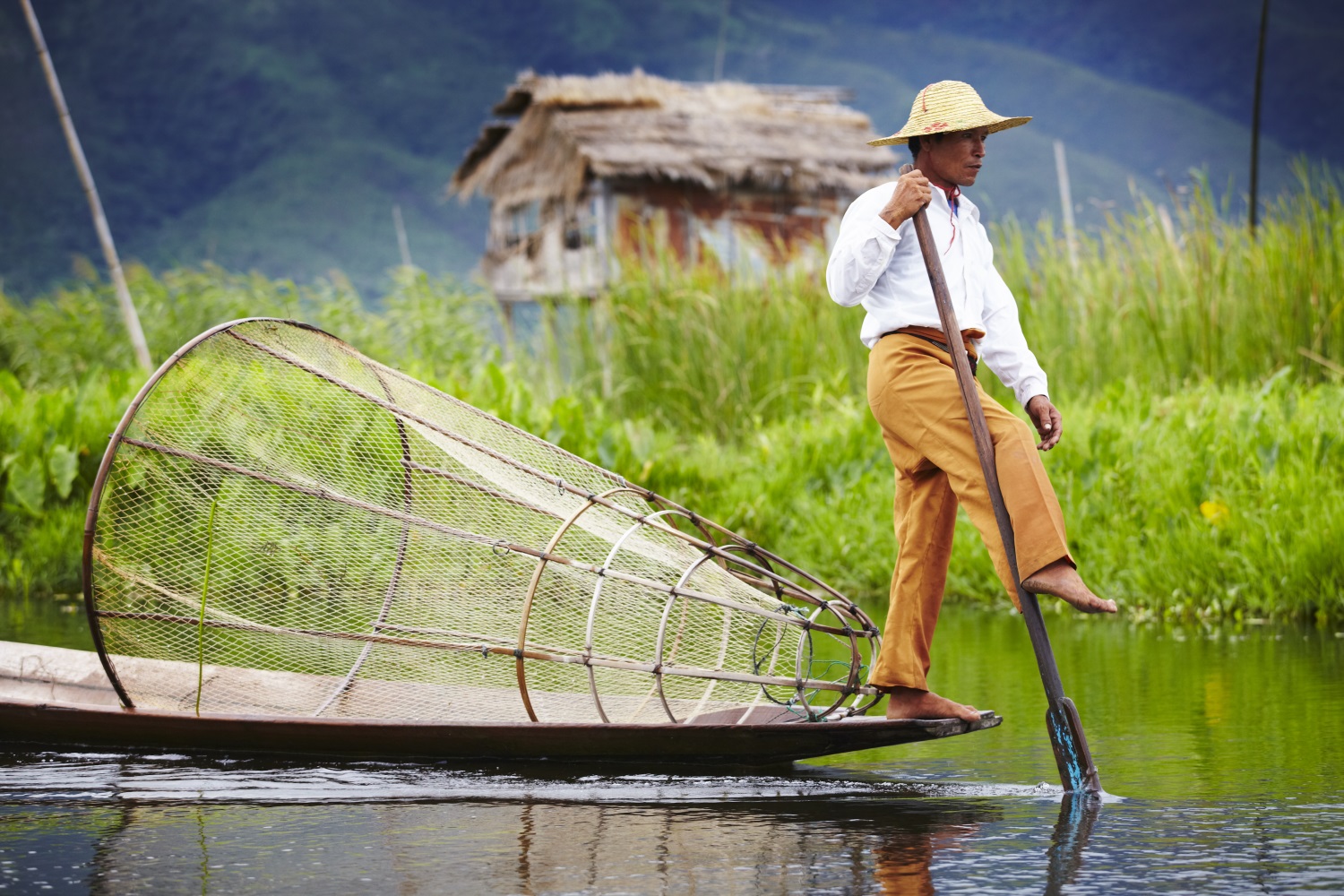 Fisherman leg rowing on Inle Lake