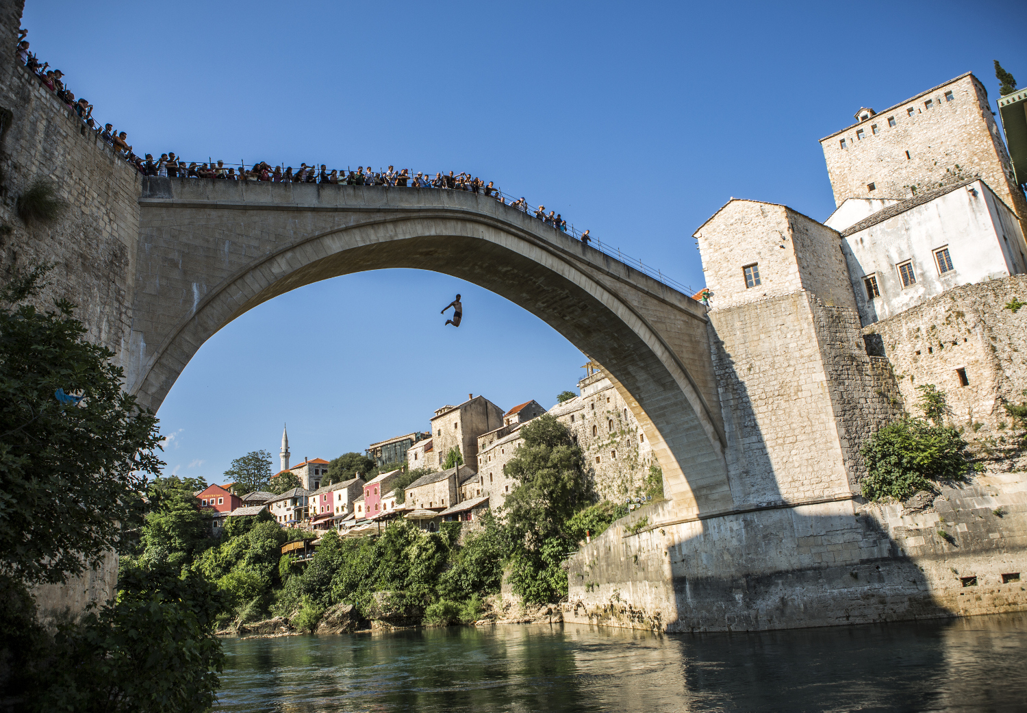 Jumping from Mostar's Stari Most. Image by Tim E White / Getty