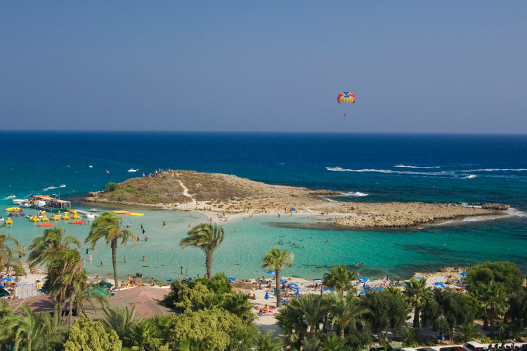 Paragliding over Agia Napa’s Nissi Beach. Image by Juergen Richter / LOOK-foto / Getty Images