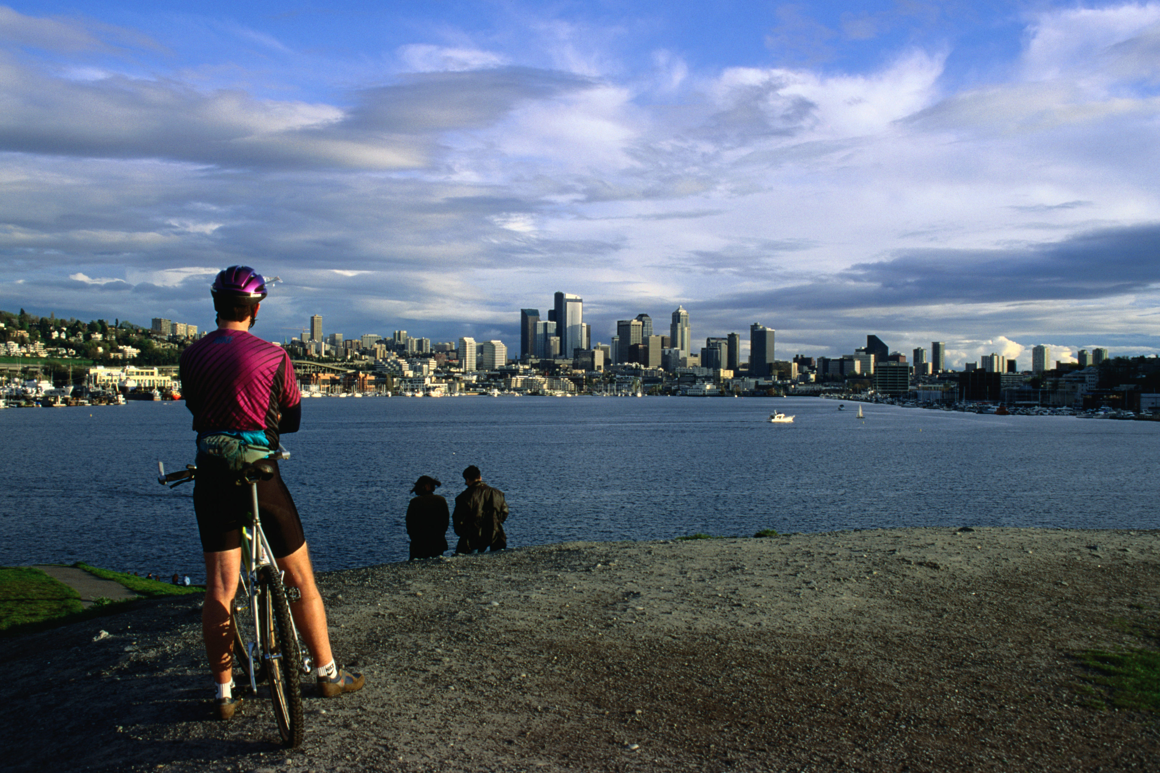 A cyclist takes a break to enjoy the view. Image by Ann Cecil / Getty