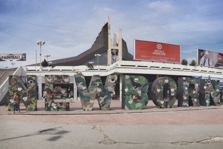 Newborn monument in front of the Palace of Youth and Sports. Image by Larissa Olenicoff / Lonely Planet