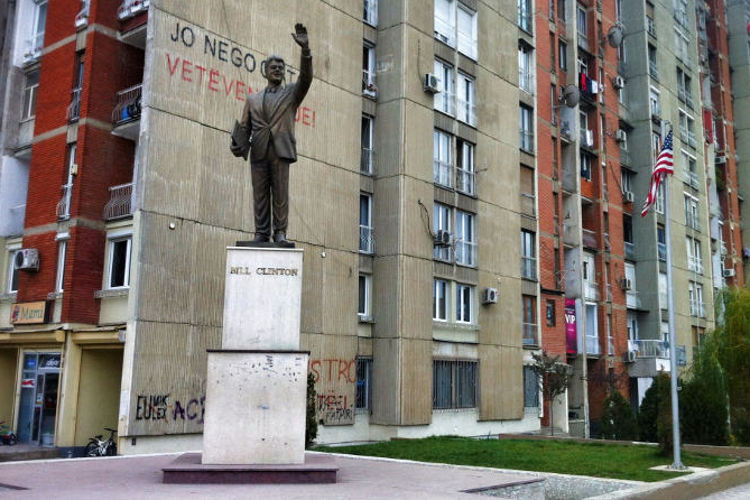 Bill Clinton statue on the corner of Bill Clinton Boulevard. Image by Larissa Olenicoff / Lonely Planet