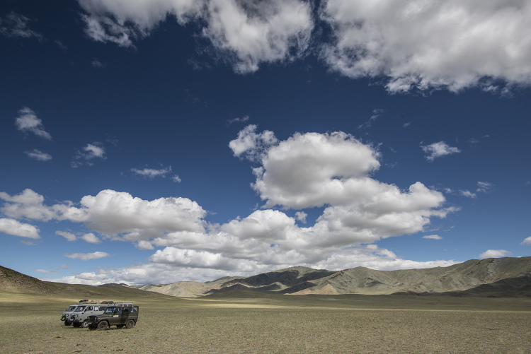 Military 4x4s provide transport in this remote land. Image by David Baxendale / Lonely Planet