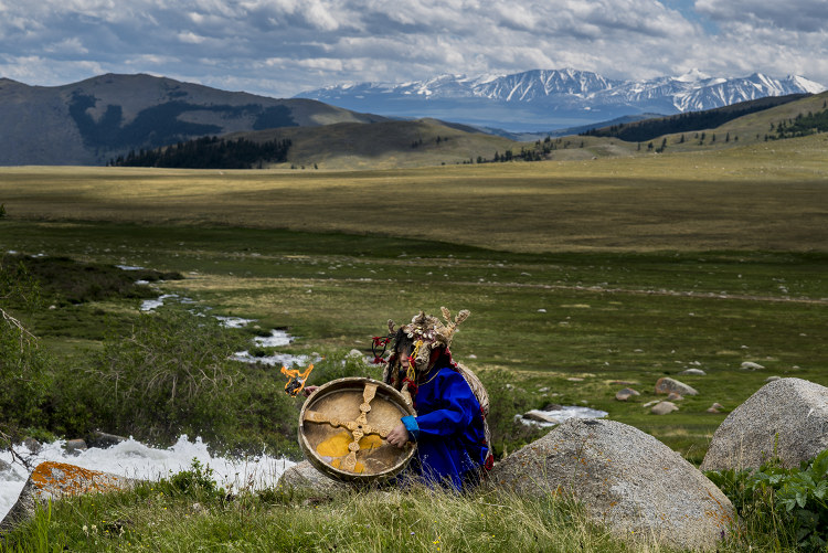 The shaman performs a waterfall ritual. Image by David Baxendale / Lonely Planet