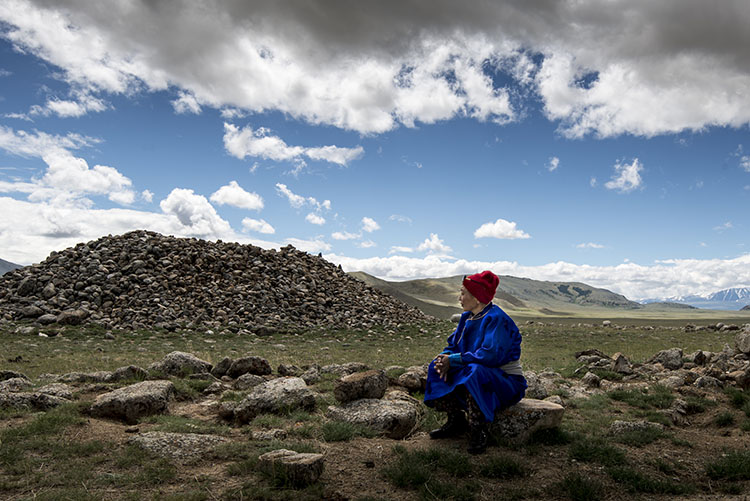 The shaman communicating with spirits at an ancient burial mound. Image by David Baxendale / Lonely Planet