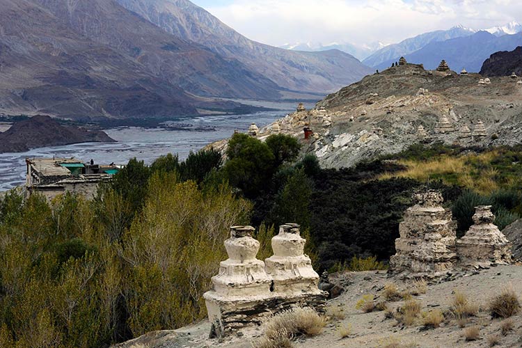 Crumbling chortens dot the hilllside around Ensa Monastery high above the Nubra River valley. Image by Amar Grover / Lonely Planet.
