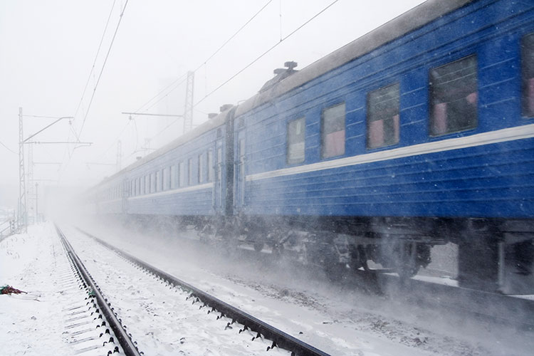 A train travelling through the snow in Siberia. Image by Fursov Aleksey / Flickr / Getty Images.