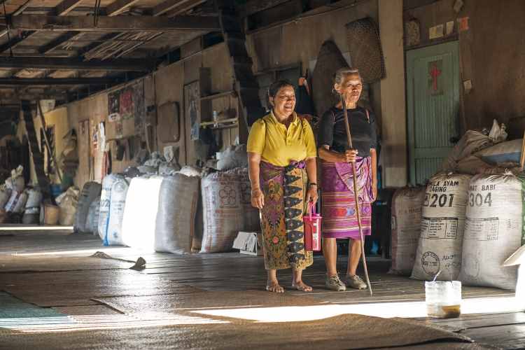 Iban women in a traditional longhouse near the Jelia River, Sarawak, northern Borneo. Image by Oliver Berry / Lonely Planet.