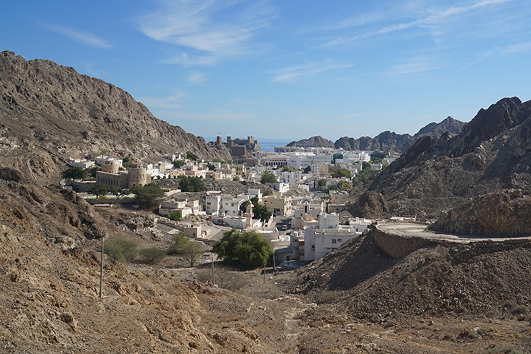 Barren mountains encircle the whitewashed buildings of Old Muscat. Image by James Kay / Lonely Planet