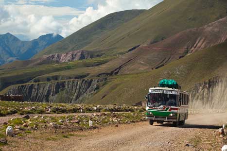 Public bus on remote road in Argentina by picturegarden / The Image Bank / Getty Images