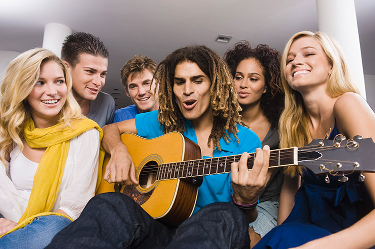 Take note: twanging your guitar in the hostel common room will not work out like this. Not at all. Pascal Broze / ONOKY / Getty Images