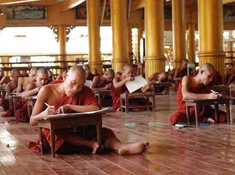 Monk examinations in Myanmar. Image from Wikimedia Commons. 