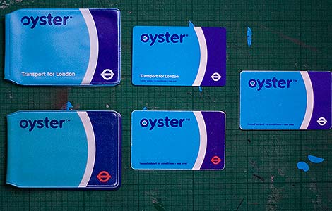 Oystercards and wallets from the London Underground. Image from Wikimedia Commons.