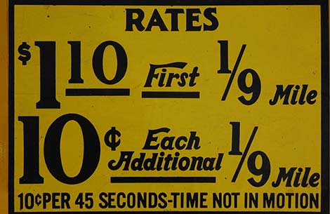Taxi fares sign by emilydickinsonridesabmx. Creative Commons Attribution Licence.