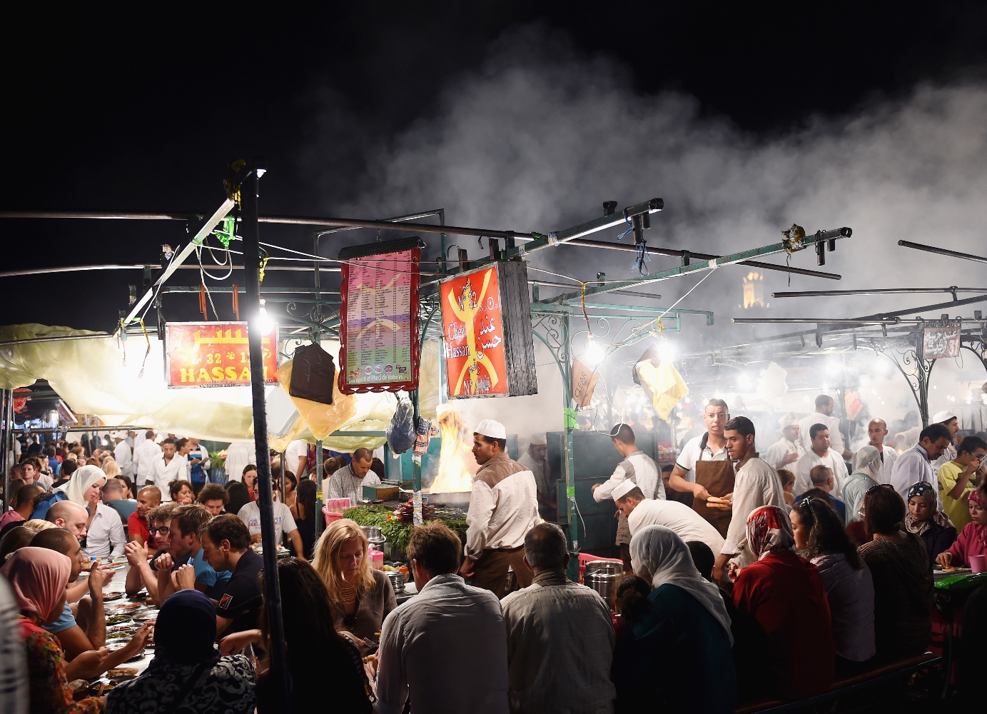 Tucking into dinner at a street kitchen. Image by Christopher Lee/Getty Images