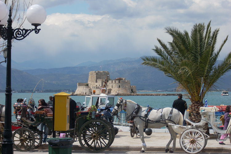 Carriages quayside in the historic Venetian town of Nafplio in the Peloponnese. Image by Alexis Averbuck / Lonely Planet