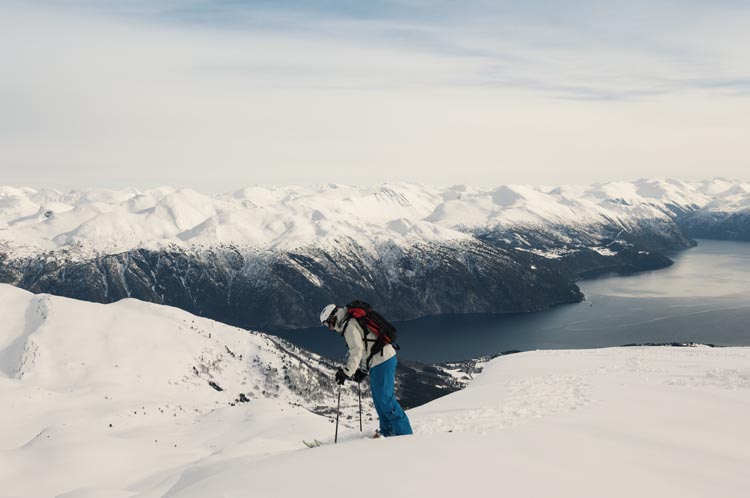 Get way off the beaten piste in Norway, to enjoy fjord views with your downhill skiing. Image by Christian Aslund / Getty Images