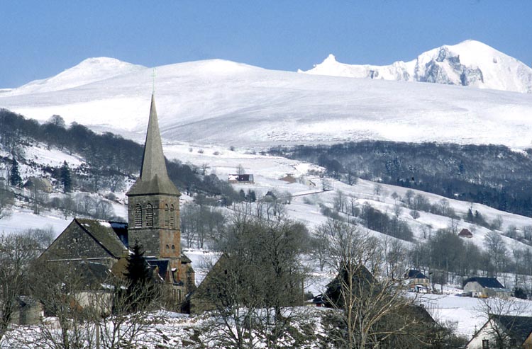 Villages in the Auvergne, like Chastreix, are a perfect base to ski or snowboard a lesser-explored part of the French Alps. Image by Bernard Jaubert / Getty Images