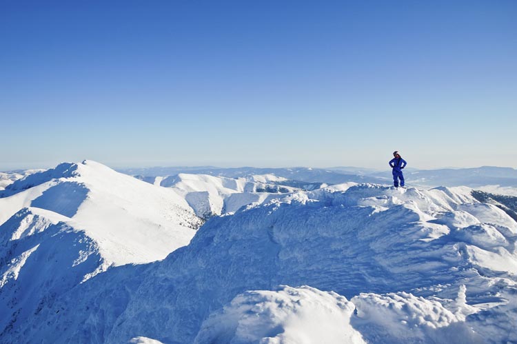 The pillowy snow of Slovakia's Chopok Mountains are packed with uncrowded winter sports terrain - and passes are cheap. Image by itchySan / Getty Images